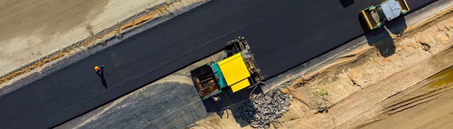 Road rollers working on the construction site aerial view